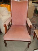 A wood framed pink upholstered arm chair, COLLECT ONLY.