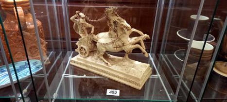 A horse and chariot figure