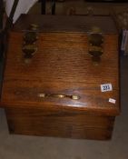 A solid oak box with sloping front and brass hinges COLLECT ONLY