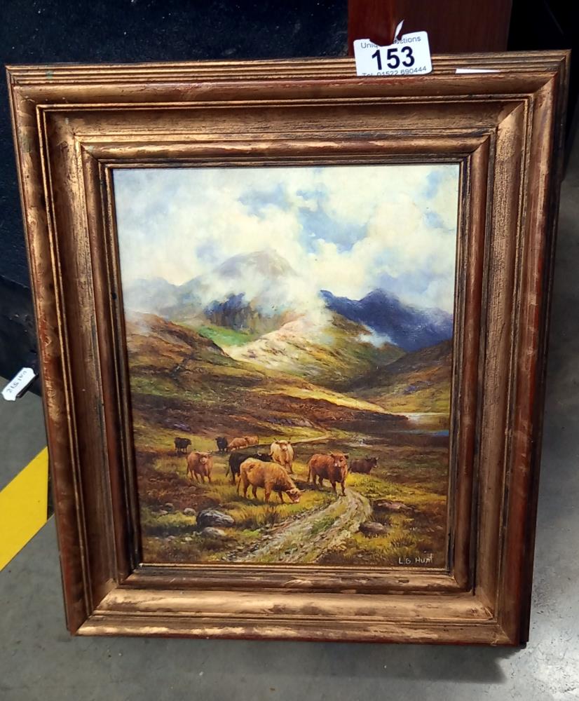 A vintage gilt framed overpainted print of Highland cattle in the shadow of mountains signed l.B