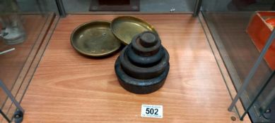 A quantity of weights and 2 brass dishes off a set of scales
