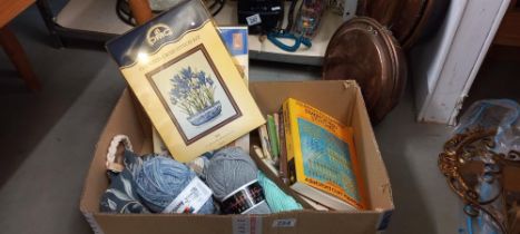 A quantity of cross stitch kits, wool and books