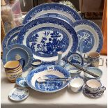 A quantity of blue and white willow pattern china etc and a rare Threlfalls blue label ale jug