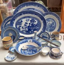 A quantity of blue and white willow pattern china etc and a rare Threlfalls blue label ale jug