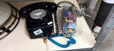 A vintage GPO telephone and a 1980's clear telephone