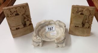 A pair of alabaster bookends and an alabaster dish (chipped on edge)