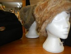 Two ladies winter faux fur hats.