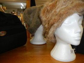 Two ladies winter faux fur hats.