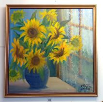 A mid 20th century gilt framed painting of sunflowers, signed but indistinct. COLLECT ONLY