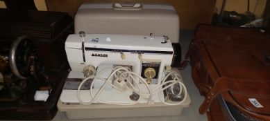 A cased electric Novos sewing machine COLLECT ONLY