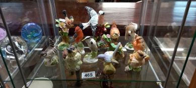 A quantity of Crown Staffordshire birds some signed J T Jones