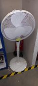 An Oscillating electric fan with stand COLLECT ONLY