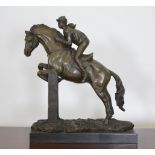 Bronze model of show jumper horse and jockey {34cm H x 28cm W}.