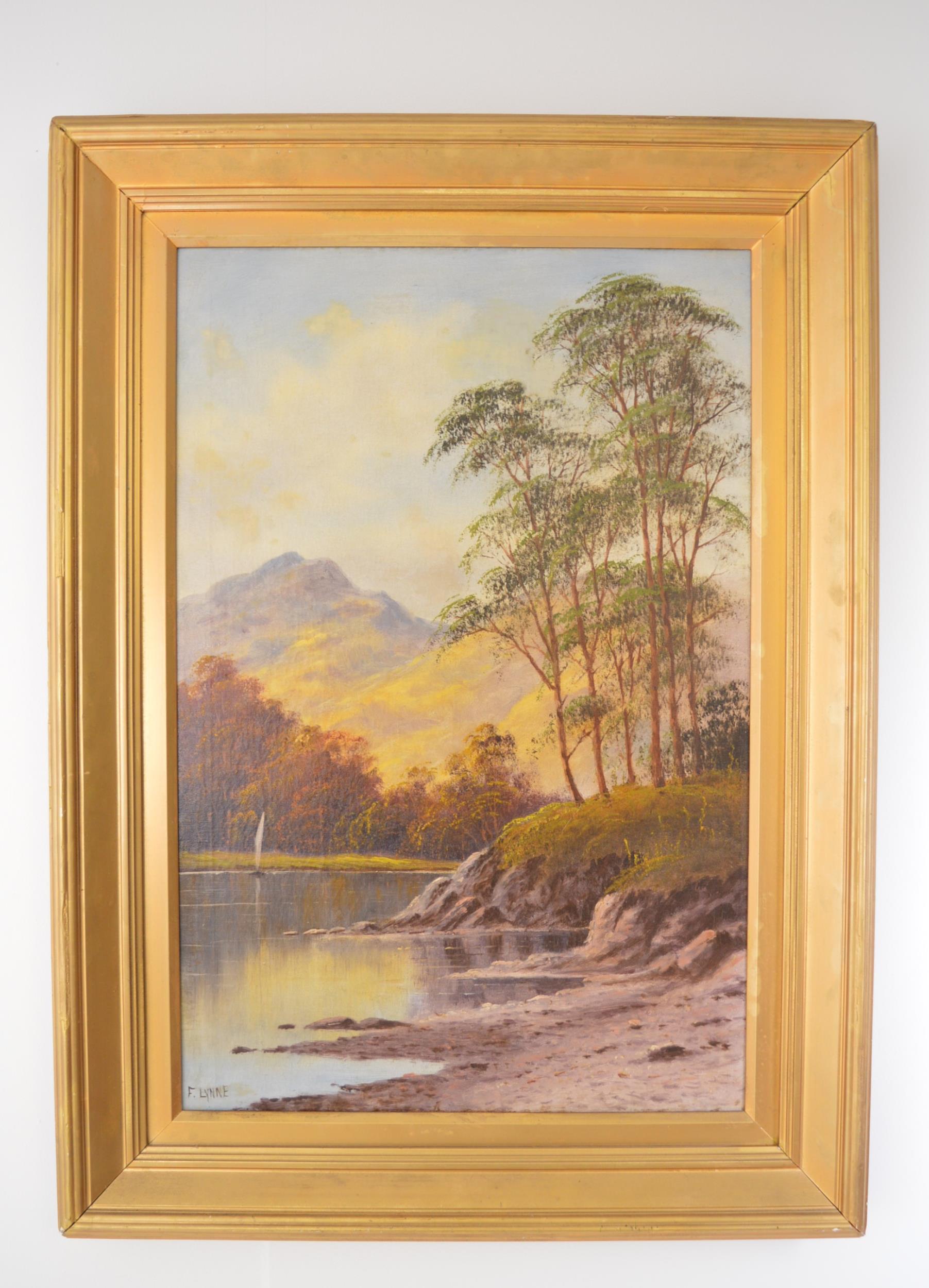 Oil on canvas Lake scene signed F. Lynne mounted in gilt frame{97cm H x 70cm W}.