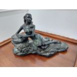 Resin model of a reclining lady {17cm H x 26cm W x 12cm D}