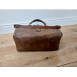 Early 20th C. leather gladstone bag {36 cm H x 47 cm W x 23 cm D}.