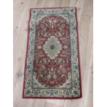 Decorative Persian rug {107 cm L x 60 cm W}.