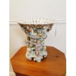 19th C. German ceramic bowl the figure of cherubs under a floral bowl with high quality applied hand