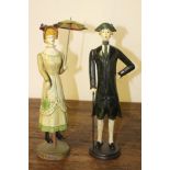 Pair of wooden figures of a Lady and Gentleman {38 cm H x 9 cm Dia.}.