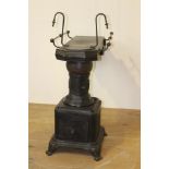 Cast iron and metal stove {100 cm H x 50 cm W x 120 cm D}.