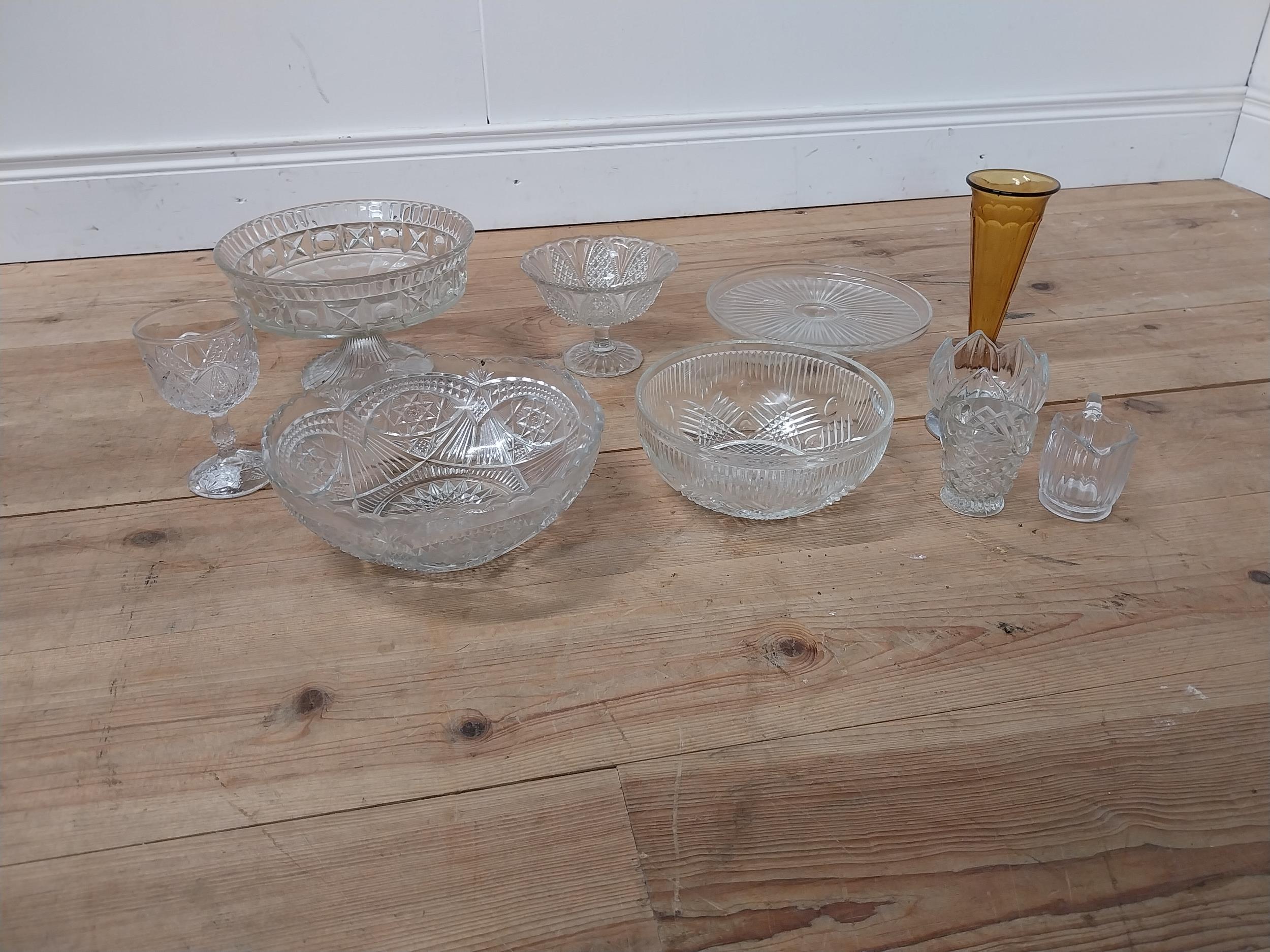 Collection of ten moulded glass vases and bowls.