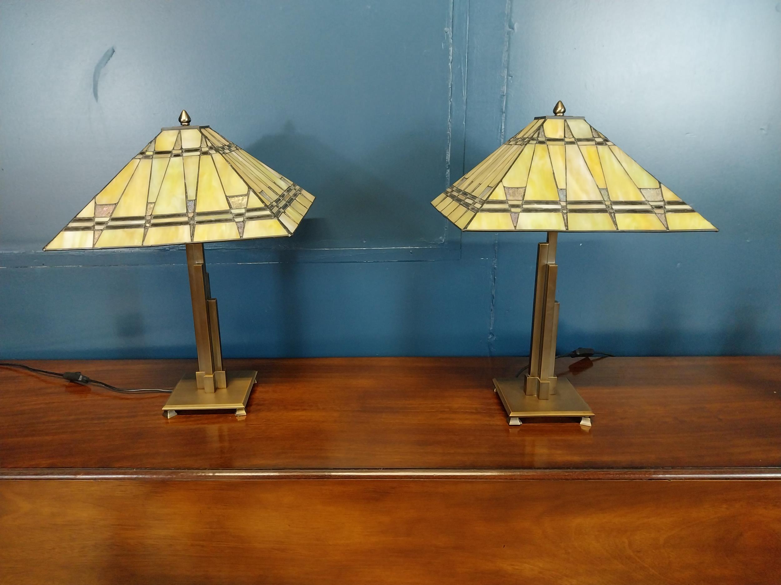 Pair of bronzed metal table lamps with stained glass leaded shades in the Art Deco style {61 cm H