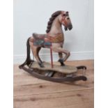 Carved pine and hand painted child's rocking horse {74 cm H x 84 cm W x 25 cm D}.