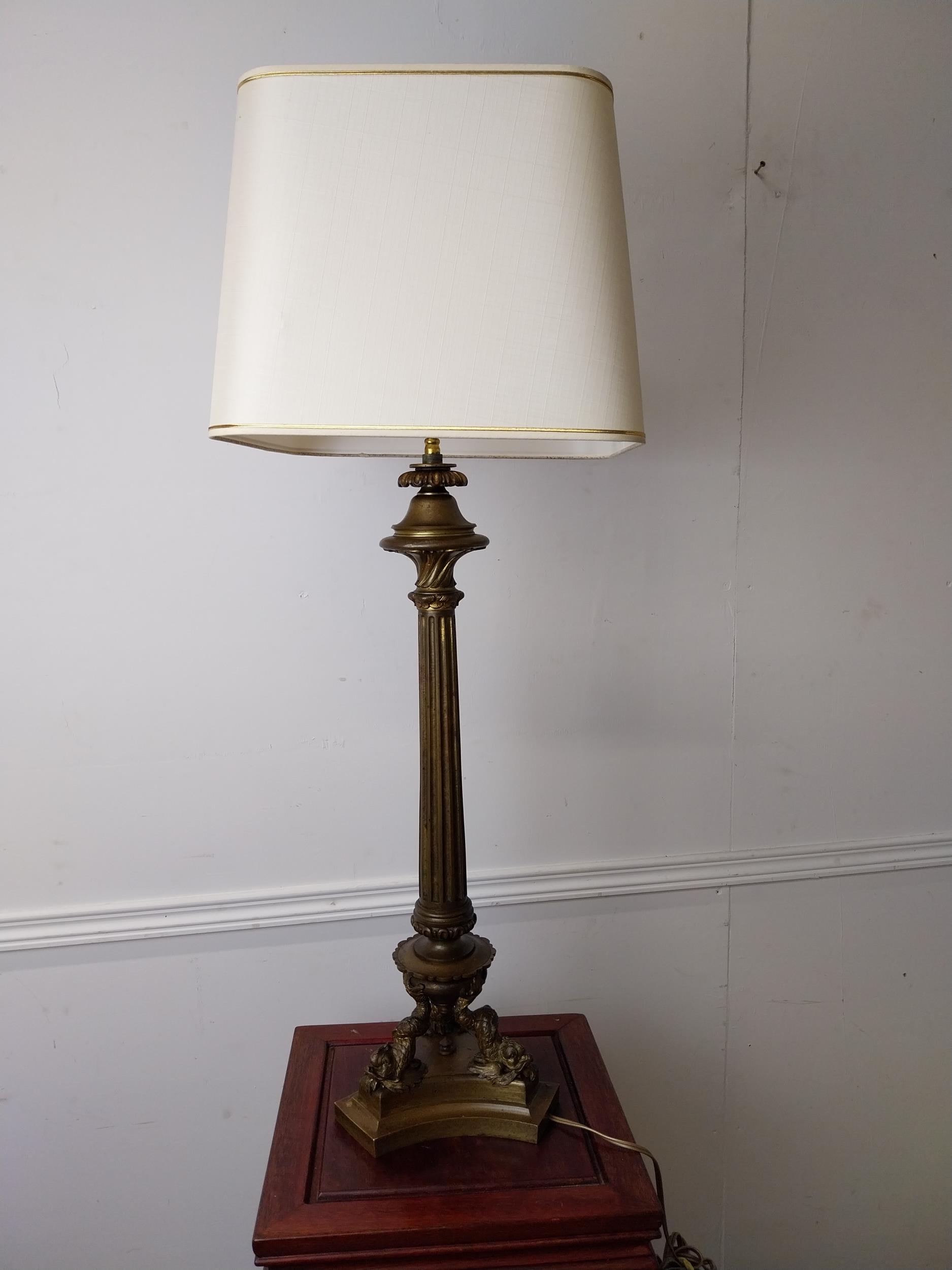 Exceptional quality 19th C. gilded brass table lamp raised on fluted column decorated with carp {