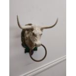 Cast iron wall mounted bull tie {23 cm H x 25 cm W x 17 cm D}.