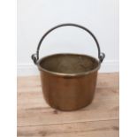 Early 20th C. brass log bucket with wrought iron handle {54 cm H x 53 cm Dia.}.