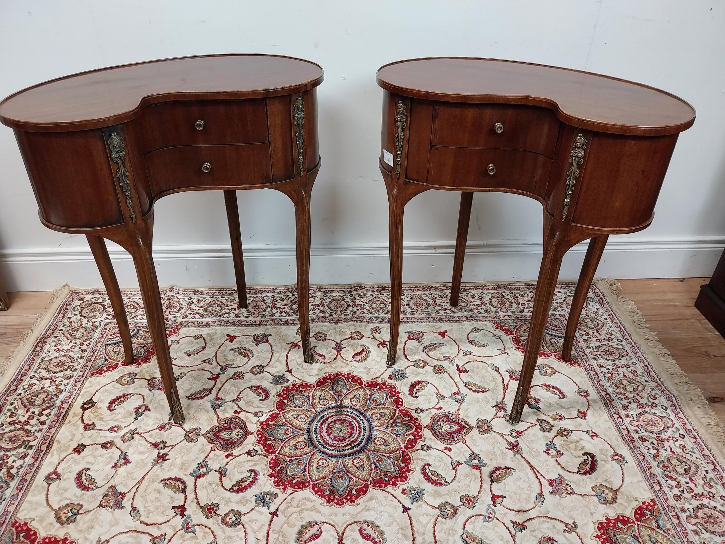 Pair of good quality kidney shaped walnut bedside cabinets with ormolou mounts raised on cabriole