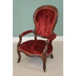 Victorian mahogany and red velvet upholstered armchair raised on cabriole legs {110cm H x 62cm W}.