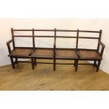 Oak four seater bench with bentwood motif seat {92 cm H x 200 cm W x 40 cm D}.