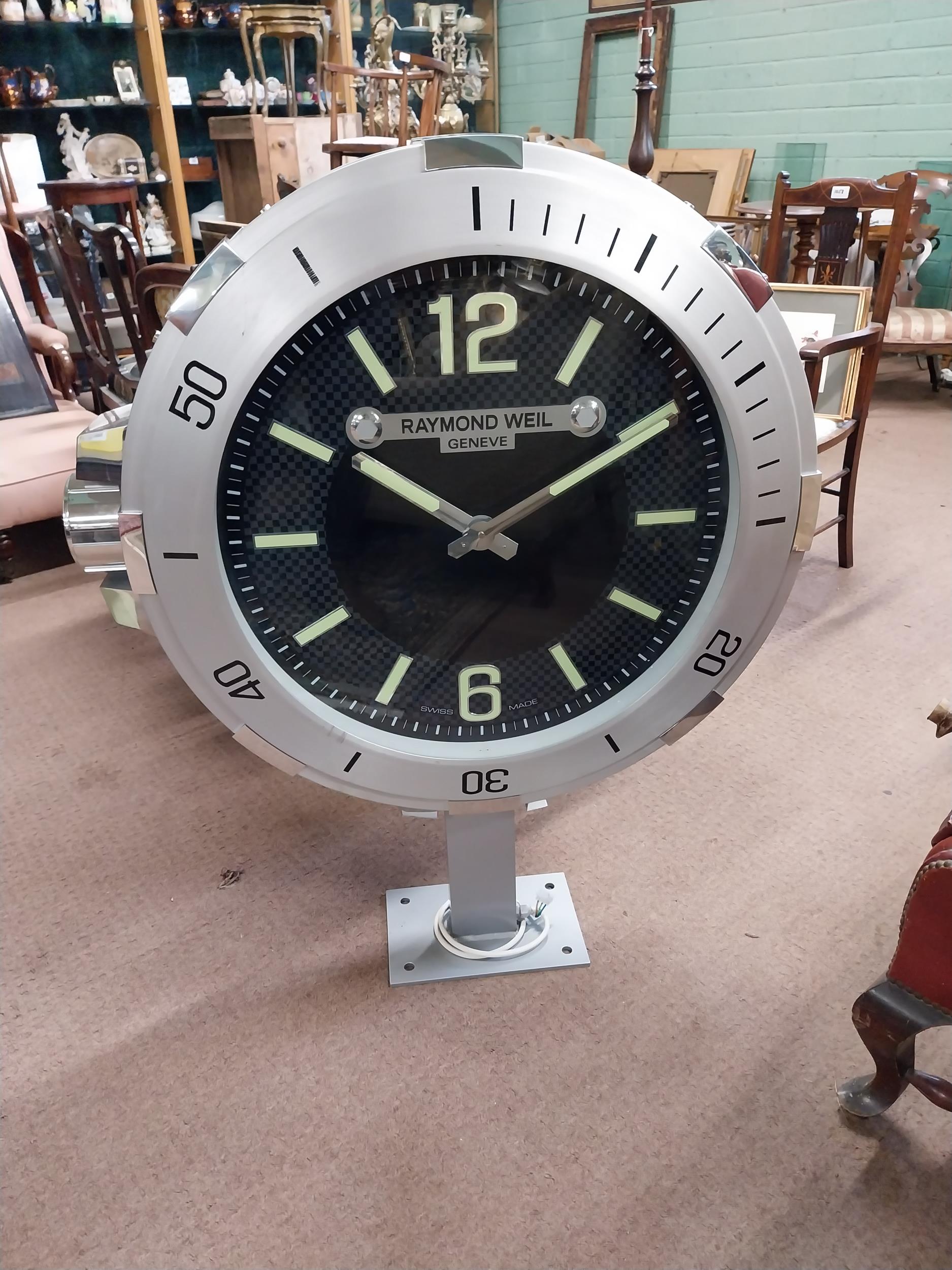 Raymond Weil Shop display advertising clock on stand. {110 cm H x 90 cm W x 27 cm D}.