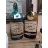 Two empty John Jameson Whiskey bottles. {29 cm H x 11 cm W}