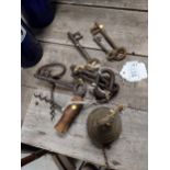 Collection of old door keys and brass bell.