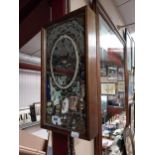 Guinness clock with mahogany case and mirrored glass . {54 cm h x 27 cm W x 7 cm D}.