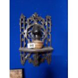 19th C. pine wall bracket with small oil lamp.