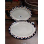 Two spongeware and transfer ceramic joint dishes {28 cm H x 37 cm W and 34 cm H x 32 cm W}.