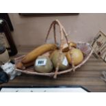 Wicker basket with artificial fruit {20 cm H x 38 cm W x 22 cm D}.