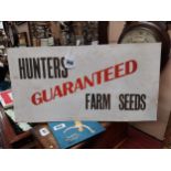 Hunters Guaranteed Farm Seeds cardboard advertising sign. { 32 cm H x 60 cm W}.