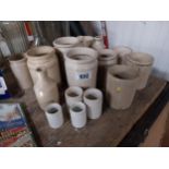 Collection of sixteen early 20th C. stoneware jars and bottles. {40 cm H to 5 cm H}.