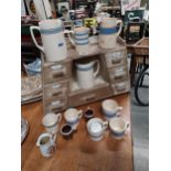 Collection of nine blue and white Carrigaline Pottery ceramic jugs and mugs made in Ireland.