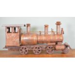 Metal model of steam engine {30 cm H x 70 cm W x 17 cm D}.