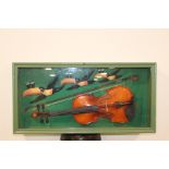 Three Guinness Toucans and a Violin glazed showcase {37 cm H x 75 cm W x 16 cm D}.