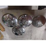 Four chrome Volkswagen hub caps. {25 cm Diam}.