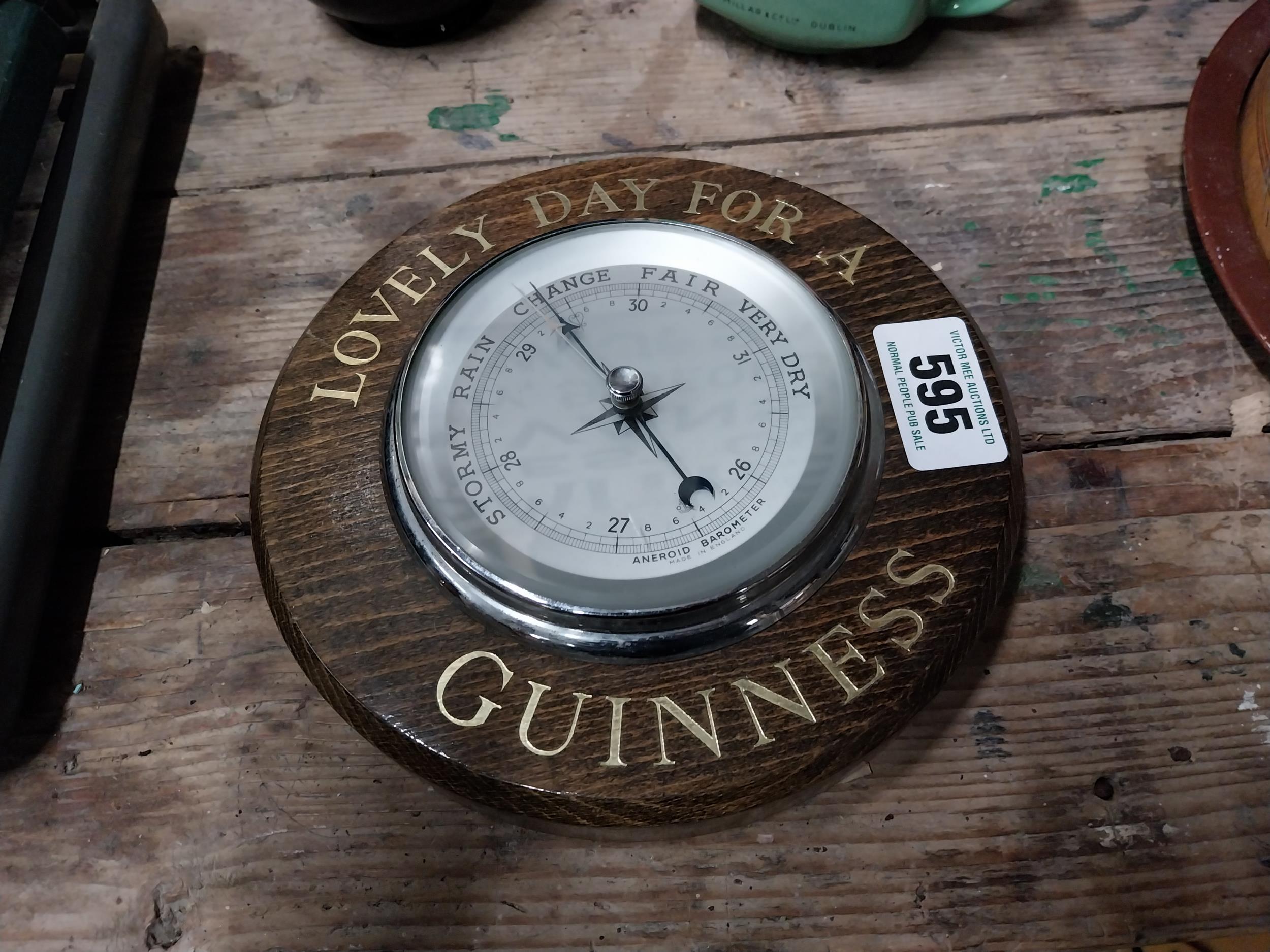 1950s oak Lovely Day For A Guinness advertising barometer {20 cm Dia.}.