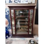 Rare 20th C. Ogden’s Cigarette dispensing cabinet with reverse painted glass panel flanked by two