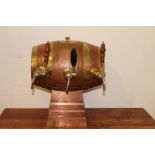 Three optic set in from of copper and brass barrel. { 48 cm H x 40 cm W x 40 cm D}.