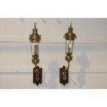 Pair of brass wall lights mounted on wooden plaques {70 cm H x 15 cm W x 30 cm D}.